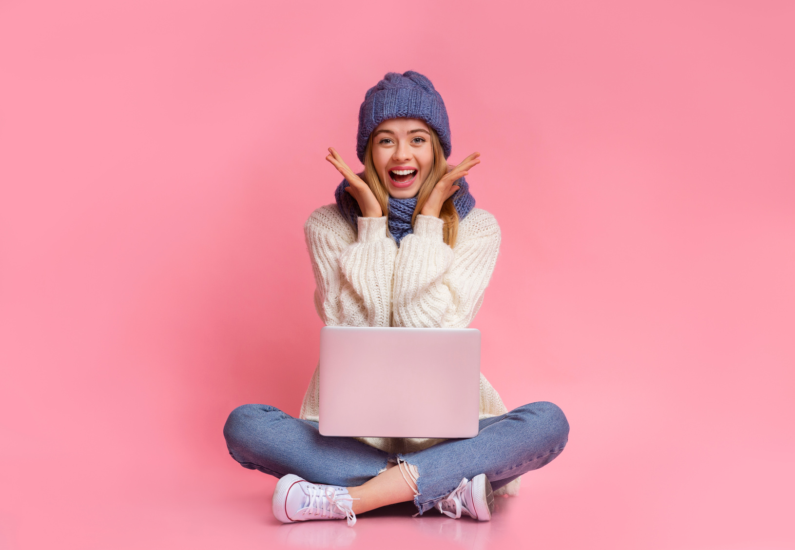 Girl with laptop expressing happiness, big sales online